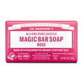 A bar of Dr. Bronners All One Pure Castile Magic Bar Soap, Rose, sits packaged with text emphasizing regenerative organic certified oils, suitable for body, face, and hands. Net Wt 5 oz140g [5 oz]